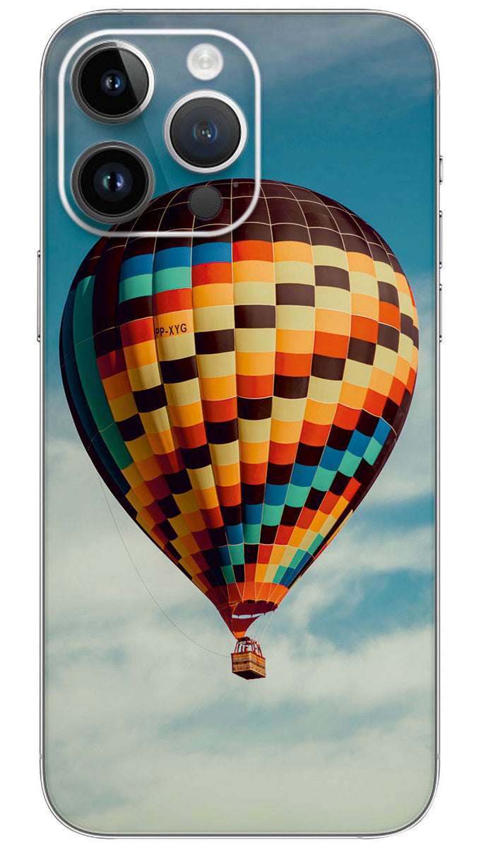 A colorful hot air balloon flying Mobile Skin Wrap